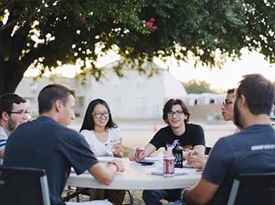 An organization sitting around a table