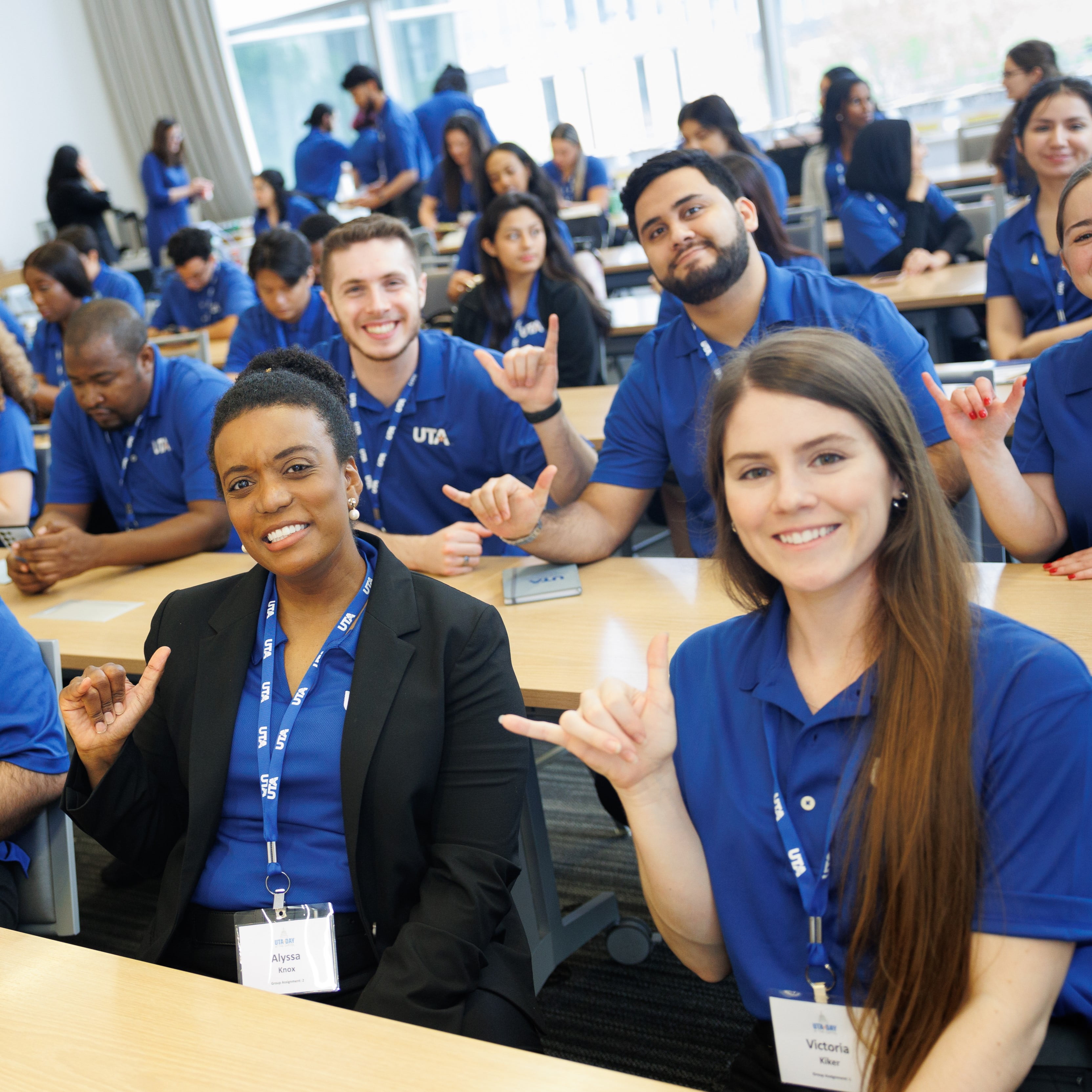 a group of UTA students is attending the event