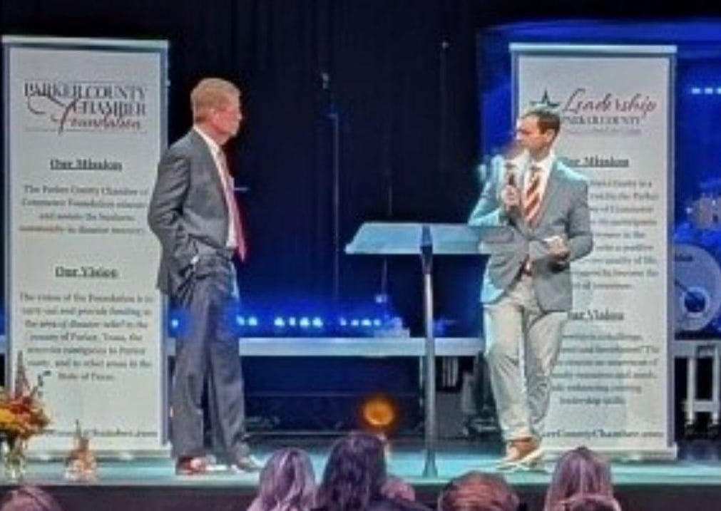 john hall standing on stage